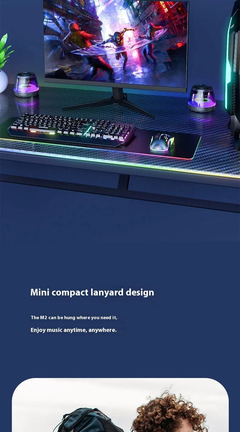 Portable white Bluetooth speaker with magnetic base, mood light, and card slot on a desk.