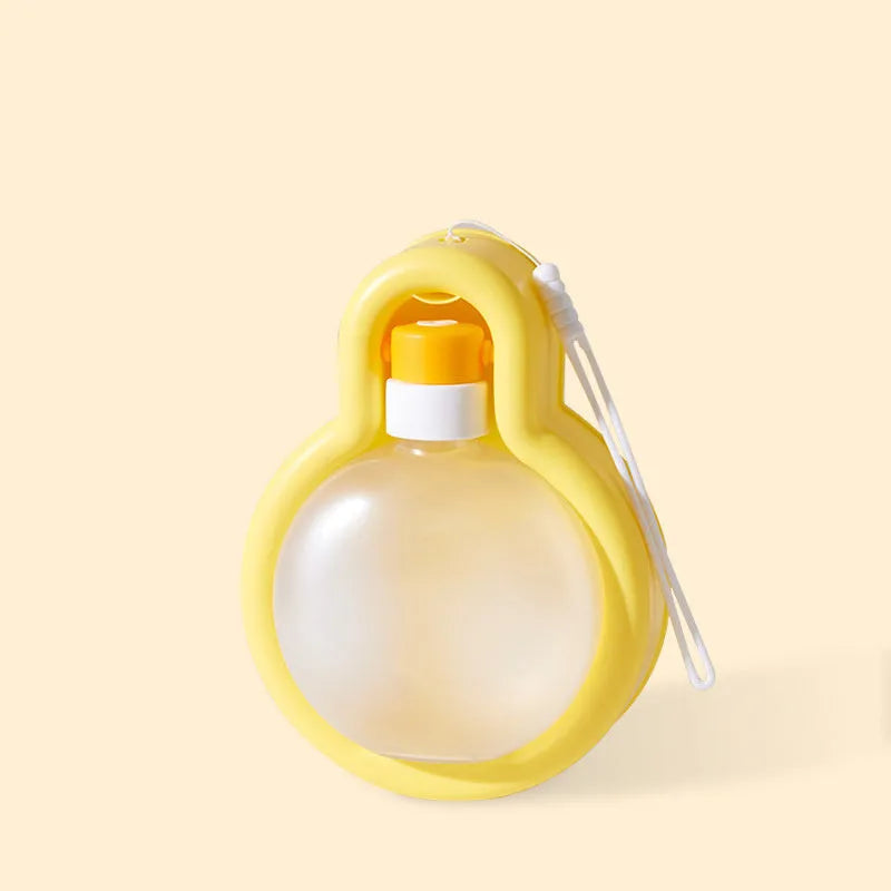 Green portable dog water bottle with fold-out drinking bowl for travel.