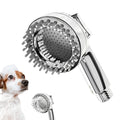 Silver coloured dog shower attachment with ergonomic grip and soft silicone comb teeth.