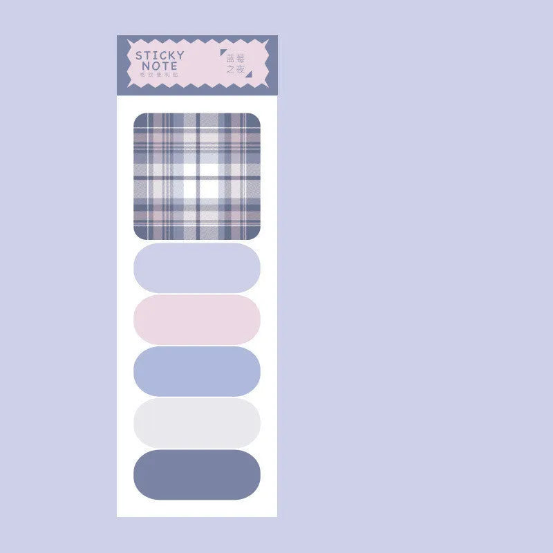 Colourful plaid sticky note memo pad showing eight different designs including blue, pink, and green patterns