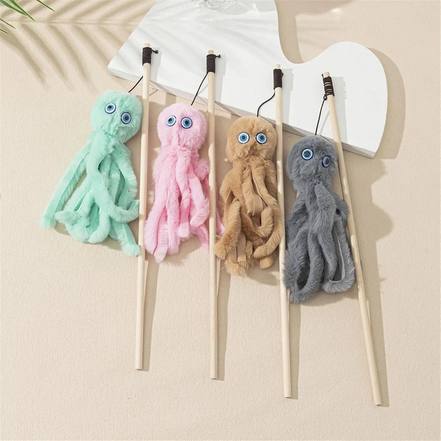 Octopus-themed cat toy with long stick handle in grey, pink, purple, or red colour options