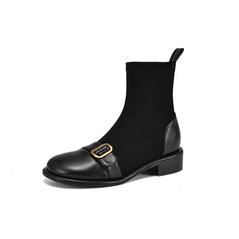 Black women's ankle boots with lace-up front and belt buckle stitching detail.