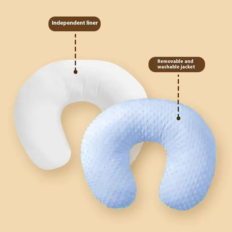 Nursing pillow with removable cover in light blue, featuring a built-in milk spilt preventer.