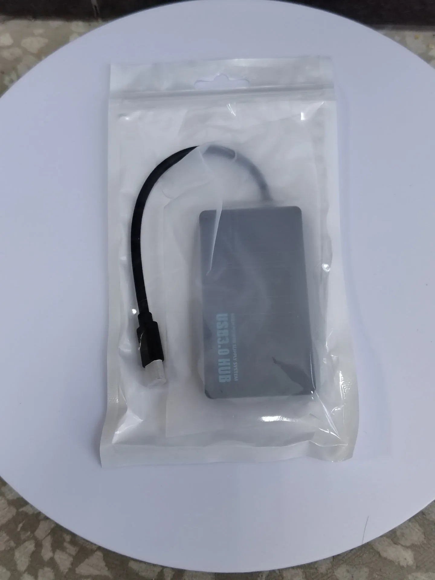 A white one-to-four-port USB hub with a 20cm cable, shown with USB-A and Type-C connector options.