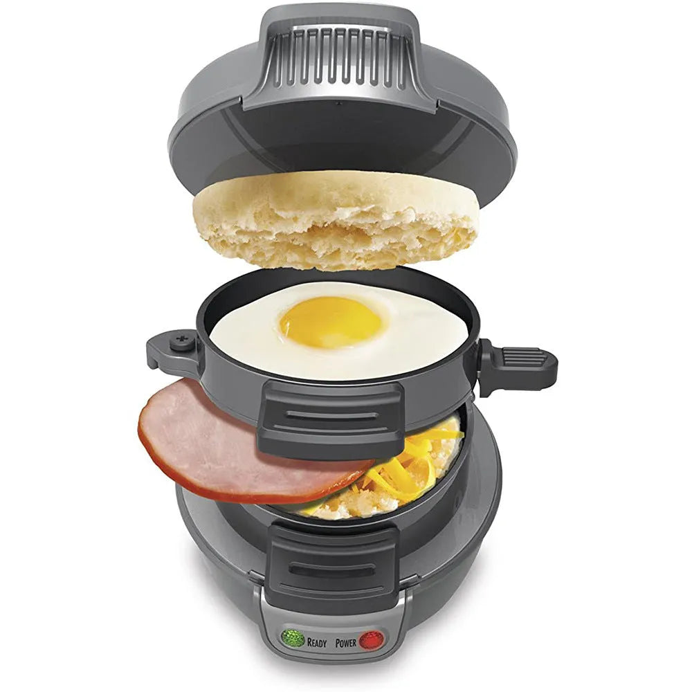 Bright red breakfast sandwich maker with egg cooking ring and waffle plates on kitchen counter