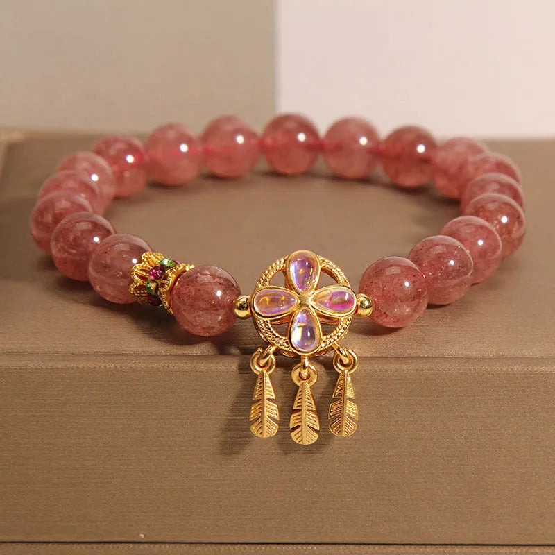 Women's strawberry quartz bracelet with dream catcher pendant and four-leaf clover charm in natural pink crystal
