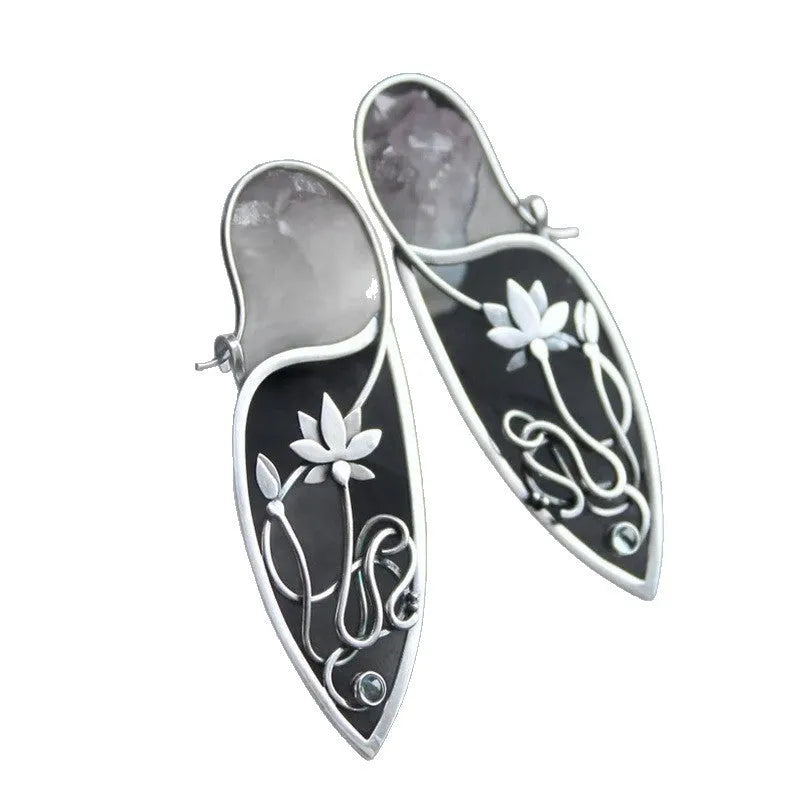 Silver geometric lotus vine earrings with rhinestone accents on white background