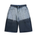 Blue tie-dye gradient washed-out cropped jeans with a loose fit and mid-waist, laid flat