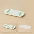 Food-grade high-capacity ice cube tray in blue with integrated storage for an ice shovel.