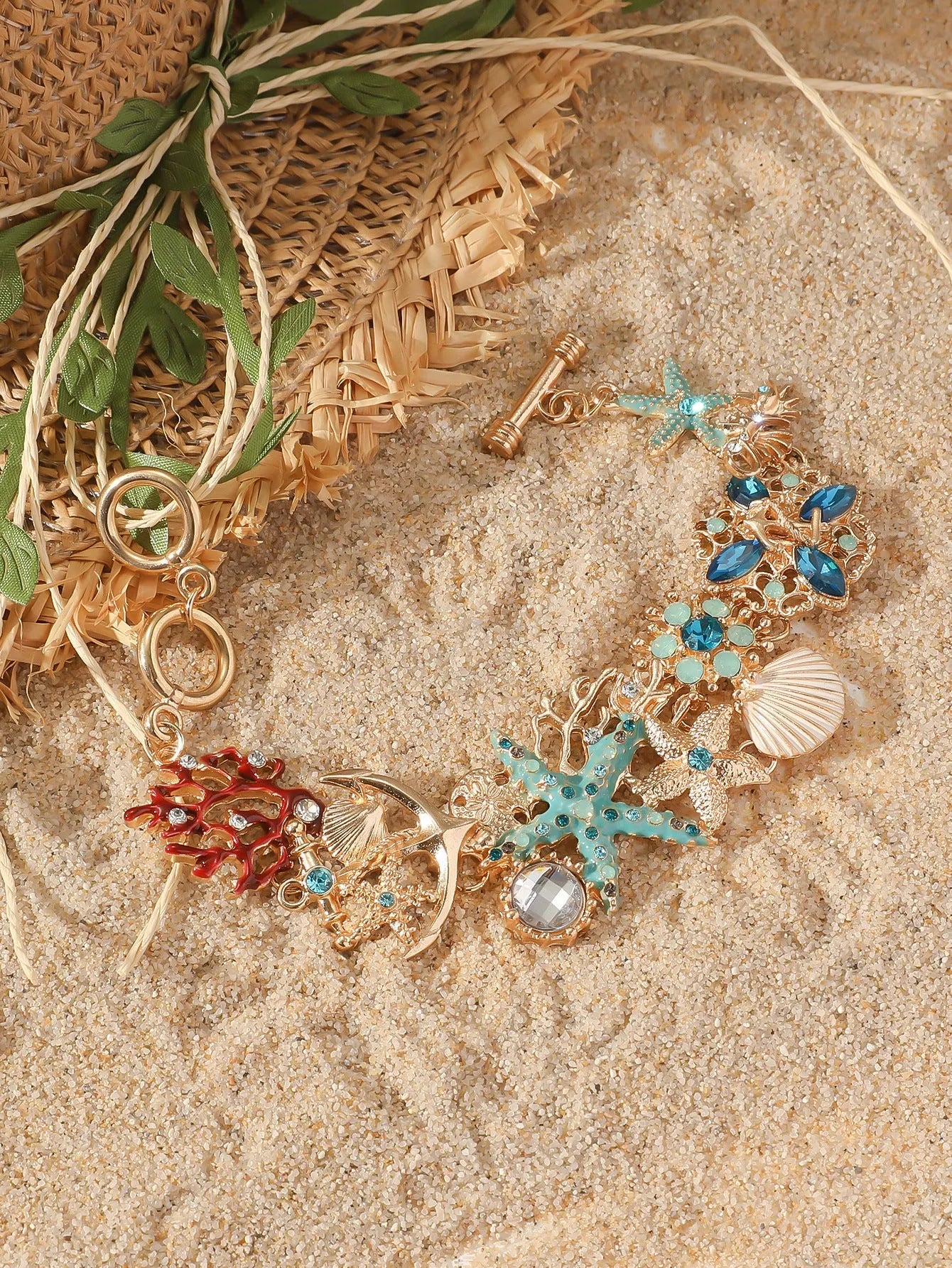 Alloy boat anchor and starfish rhinestone bracelet for women in turquoise, coral red, or coral blue.