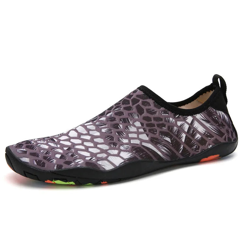 Blue Lycra beach wading shoes with EVA sole for men and women, shown on a sandy background.