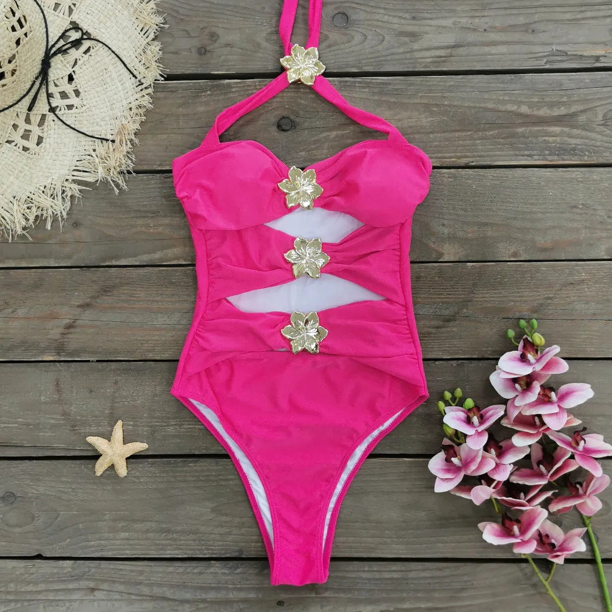 Women's solid colour one-piece swimsuit with hollow-out tube top and matching short skirt on hanger.