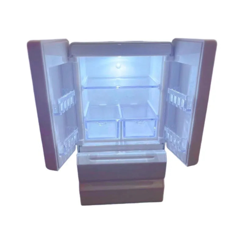 Small white illuminated candy toy model for dollhouse display, shown with light on.