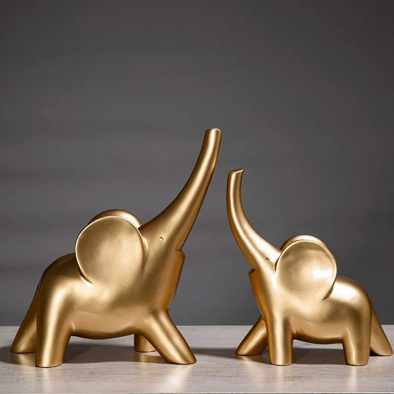 Modern minimalist elephant figurine ornament in rose gold or white resin on a plain background.