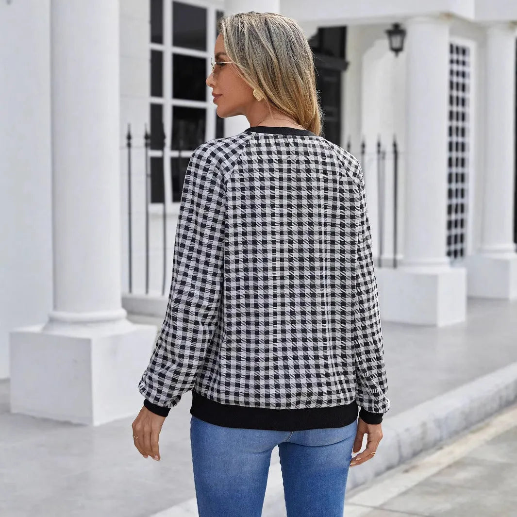 Black long sleeve pullover sweater with a classic plaid stripe print pattern.