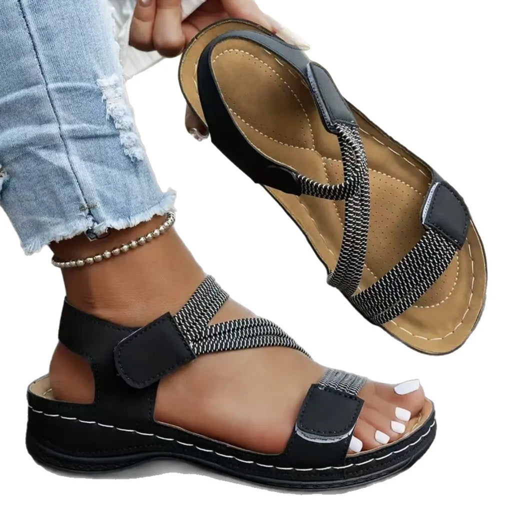 Women's lightweight sports sandals with Velcro fastening in black, showing PU upper and round toe design