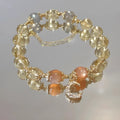 Chinese style women's crystal bracelet with diamond shaped stones and electroplated 14K gold gilded finish in citrine moon colour