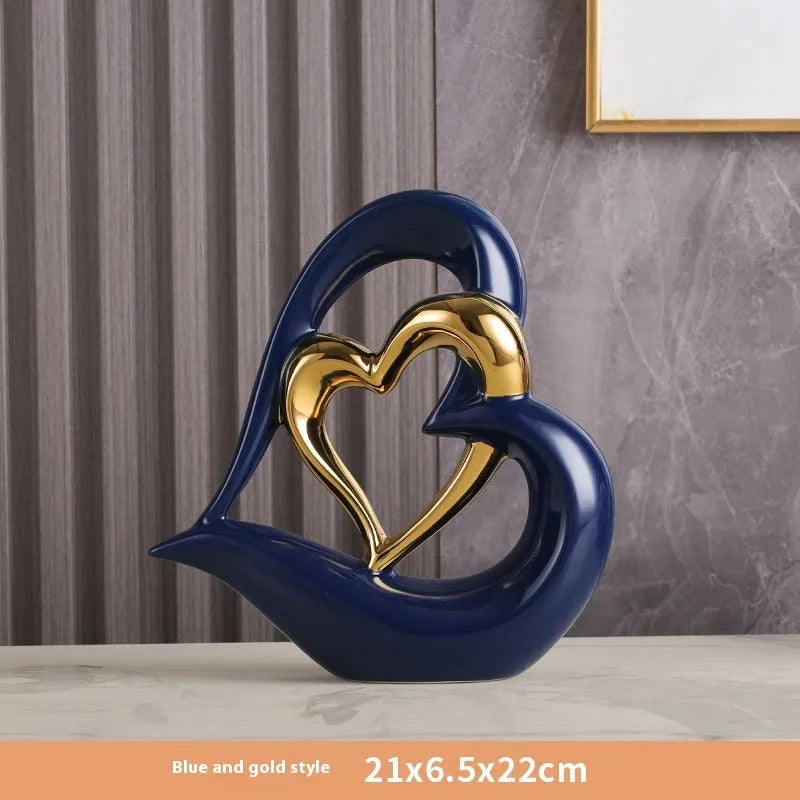 Modern geometric heart ornament in metallic finish displayed on shelf