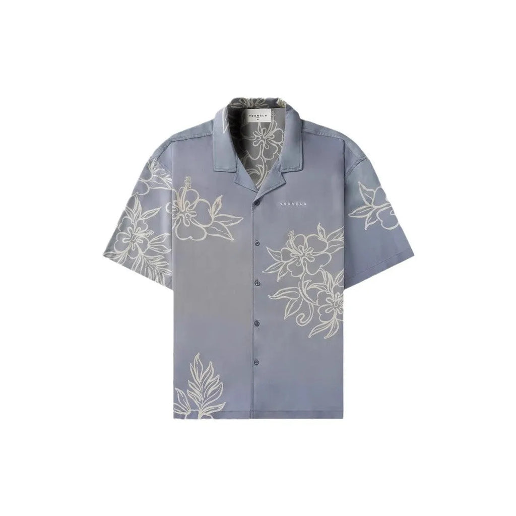 Men's loose-fit short sleeve top with floral print in light colour, laid flat.