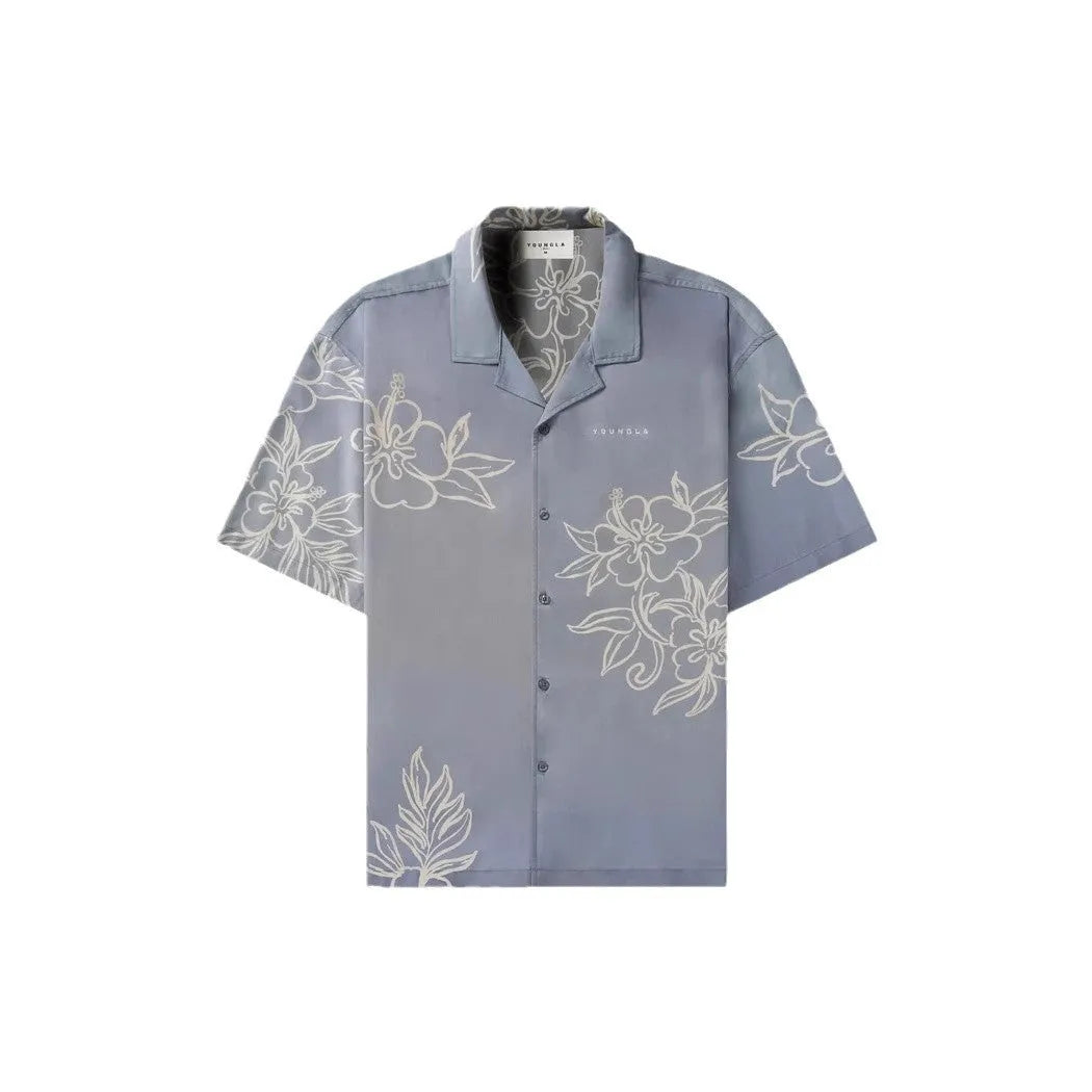 Men's loose-fit short sleeve top with floral print in light colour, laid flat.