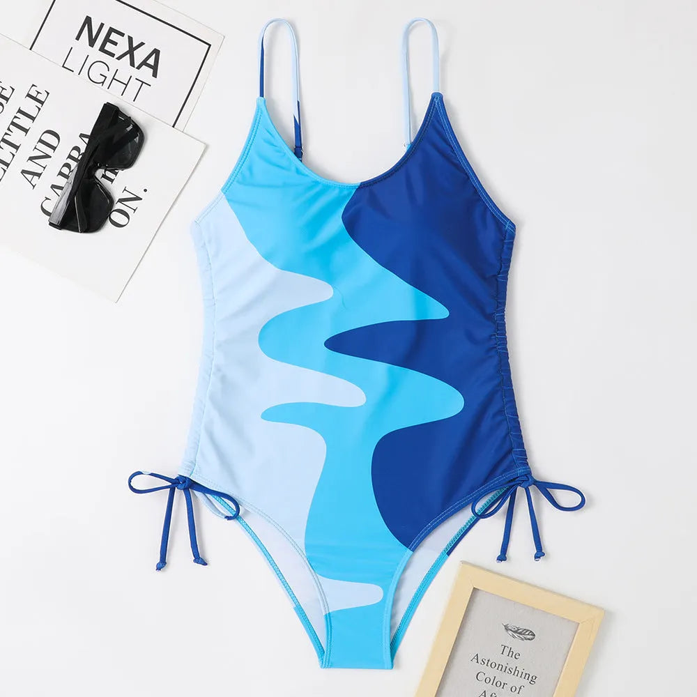 Women's sleeveless backless one-piece swimsuit in blue striped print