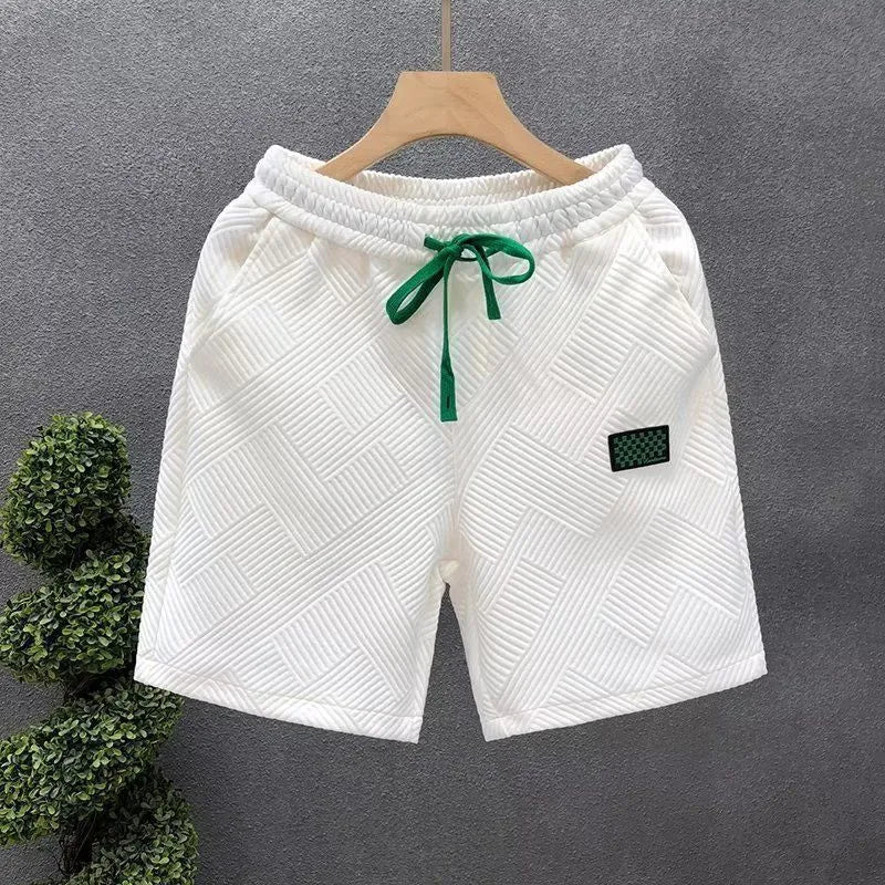 Men's solid colour casual sports shorts with micro elasticity in white, black, or green options