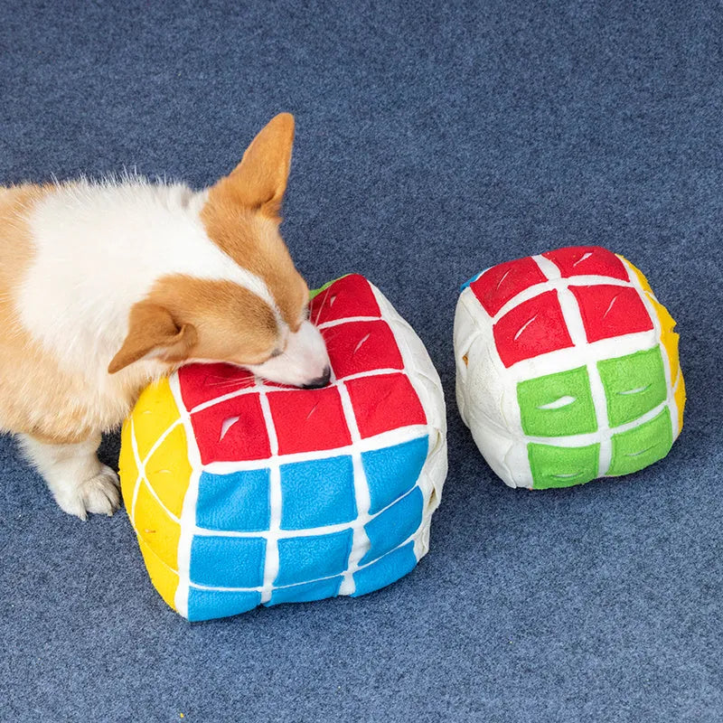 Pet Rubik's Cube sniffing toy in polar fleece fabric with treats visible, 15cm cube on a light background