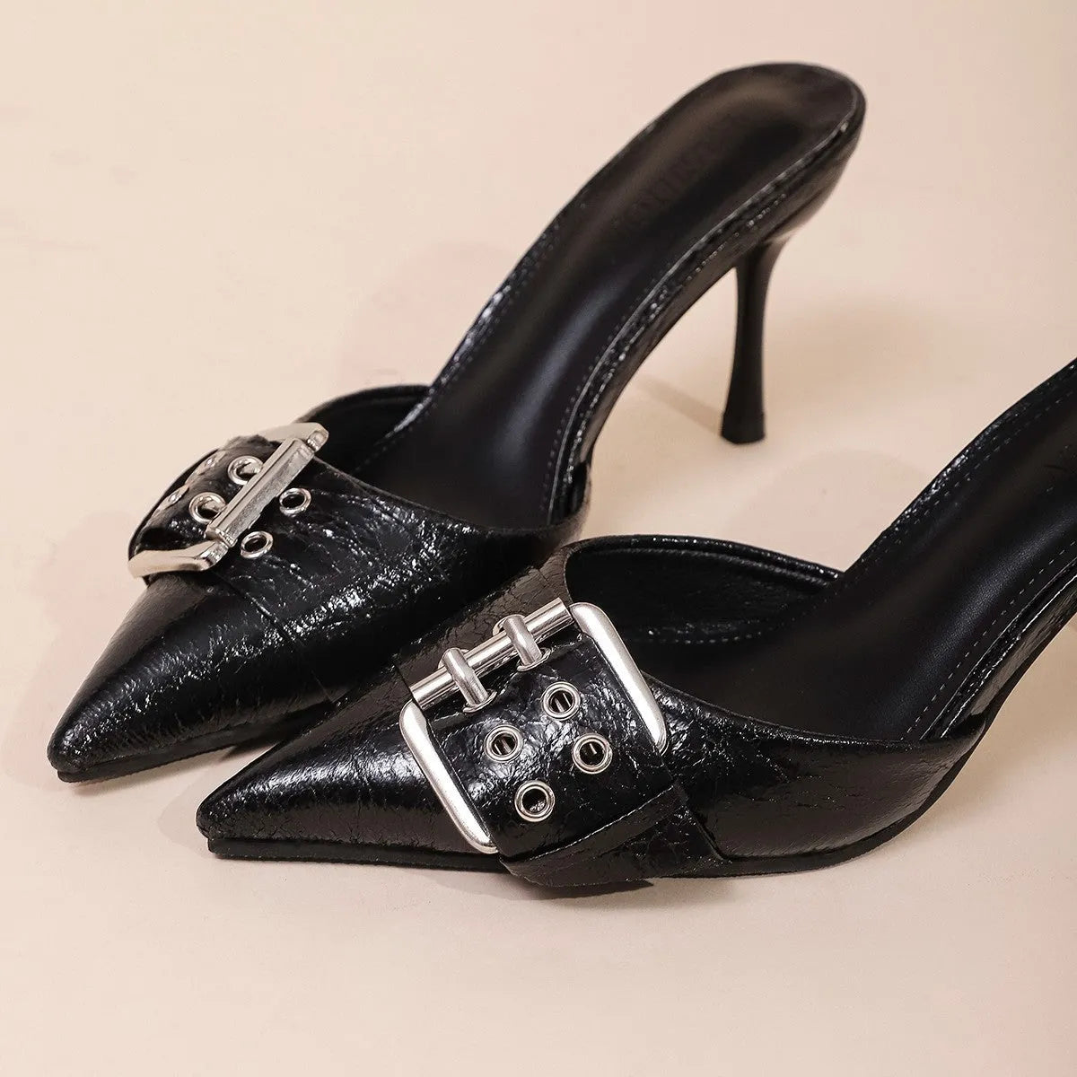 Black women's high heels with pointed toe and decorative buckle ankle strap