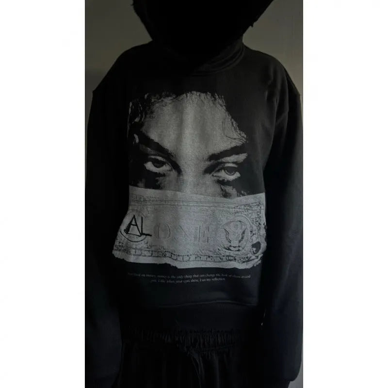 Black women's hoodie with cartoon print design in loose fit polyester fabric