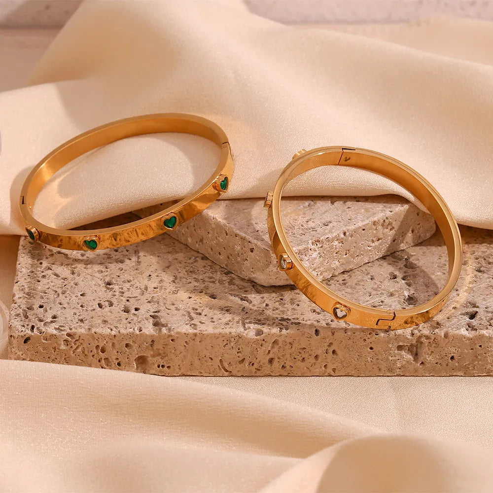 Gold electroplated stainless steel bracelet with micro-inlaid peach heart design and diamond accents