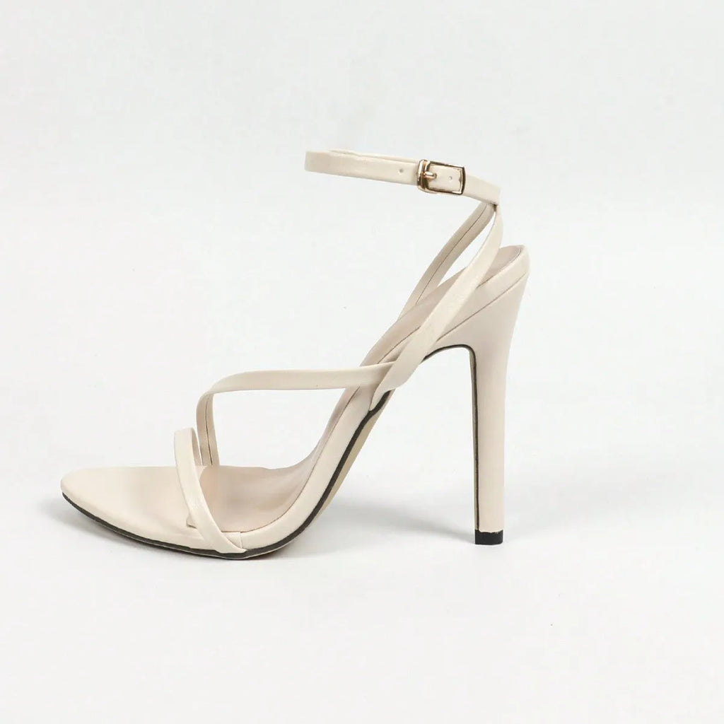 Gold women's sandals with multi-stripe ankle strap, open toe, and round toe design on a rubber sole.