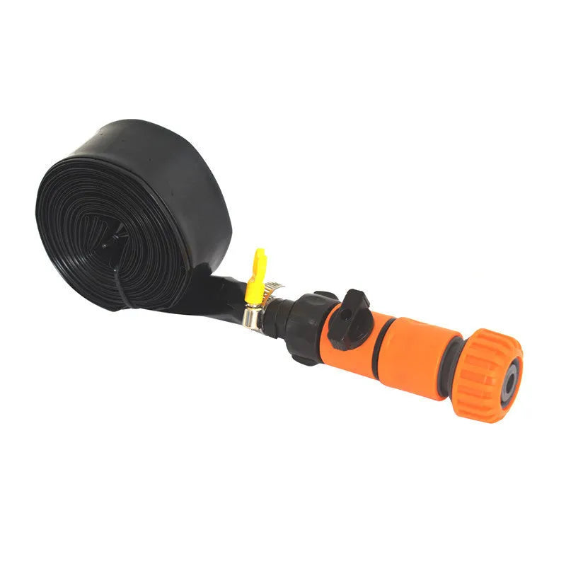 Blue and orange portable plastic garden sprinkler on a lawn with PVC switch.