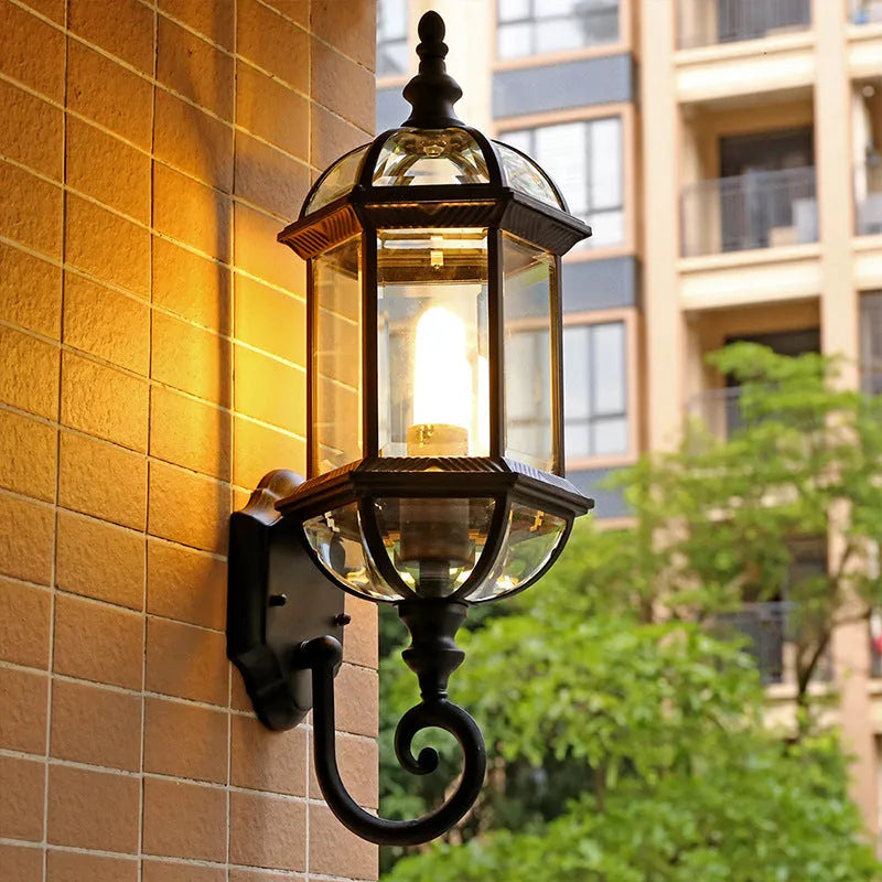 Gold and black outdoor aluminium wall lamp with a three-layer, eight-inch waterproof design.