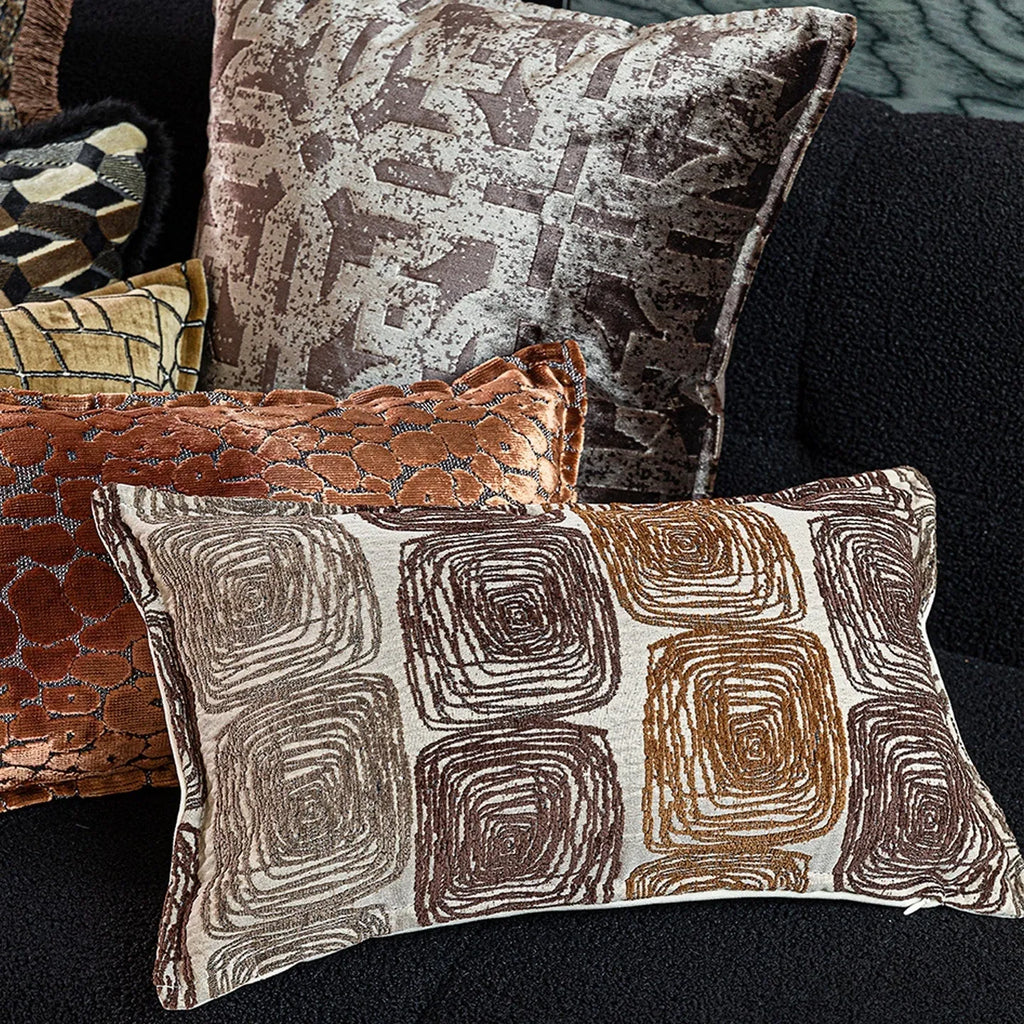 Cream and coffee coloured abstract coil pattern pillow cover shown in square and waist pillow sizes.