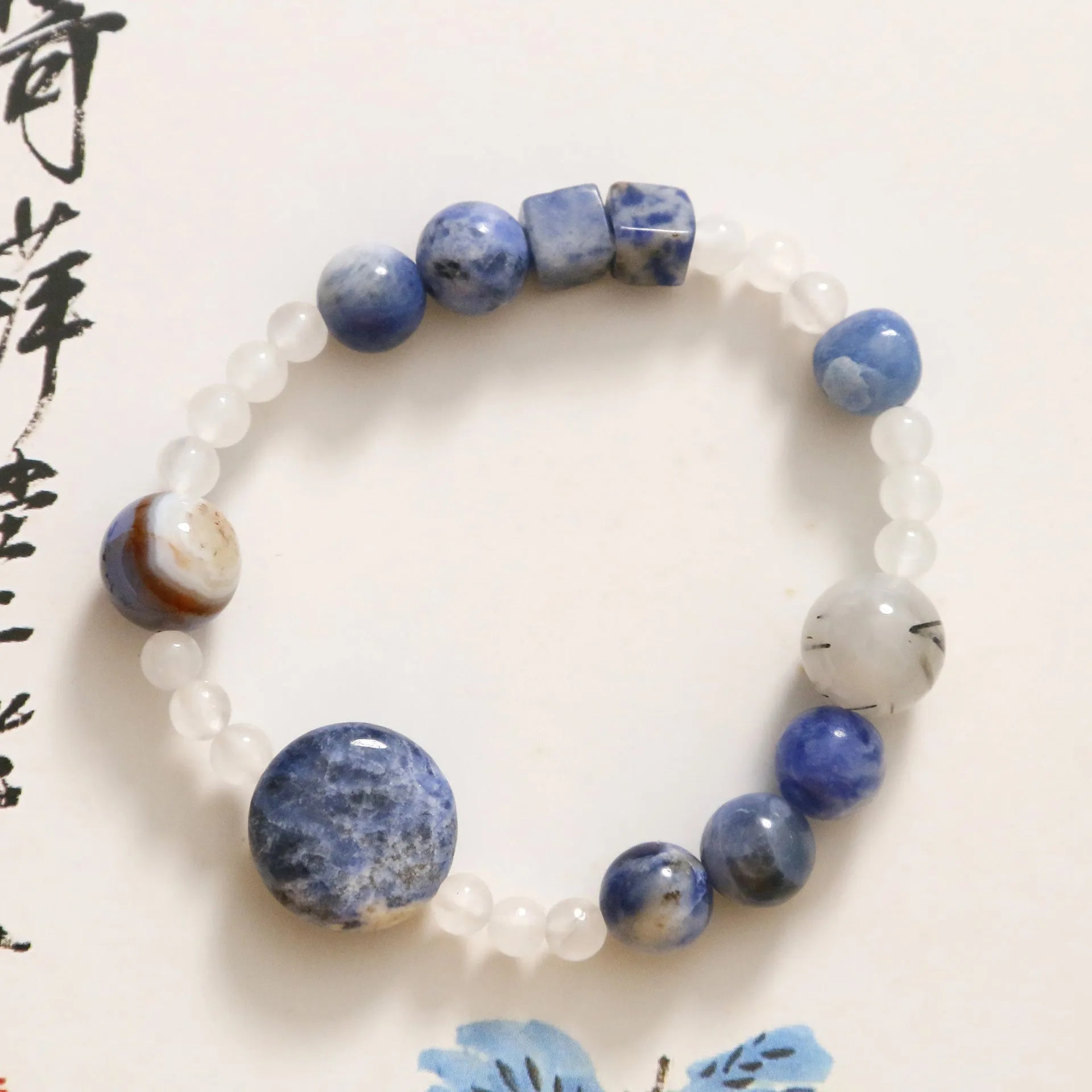 Hand-woven natural stone bracelet with blue point and black hair crystal agate beads