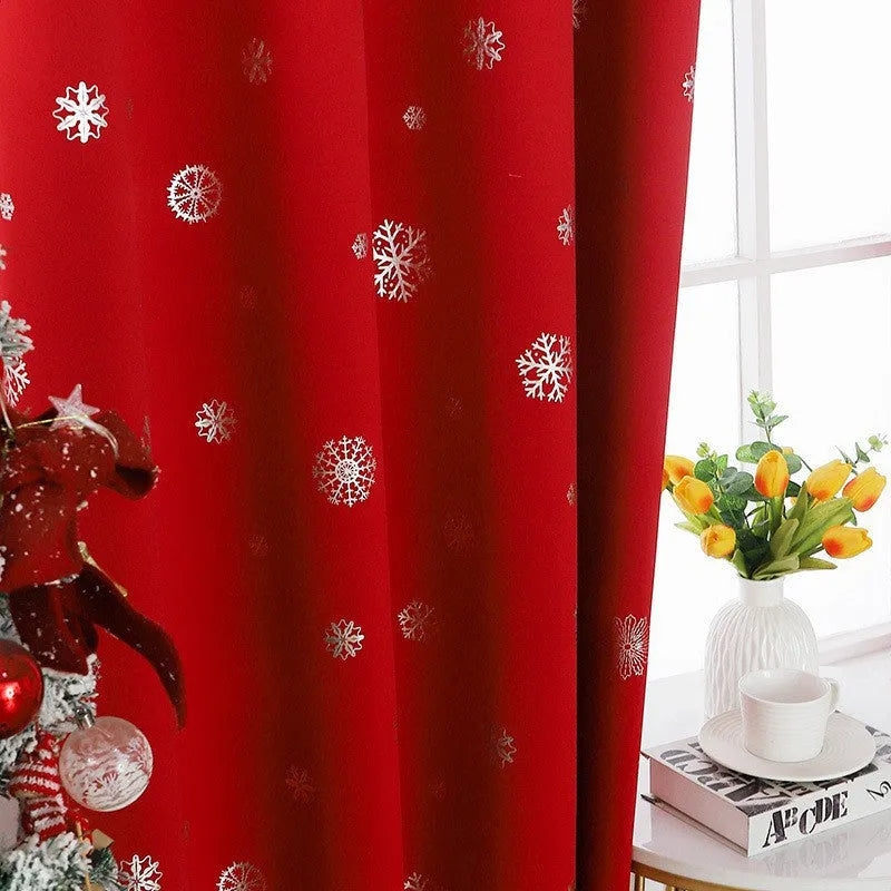 Red or green snowflake pattern shade cloth curtain with coordinating lace loops and iron hoops