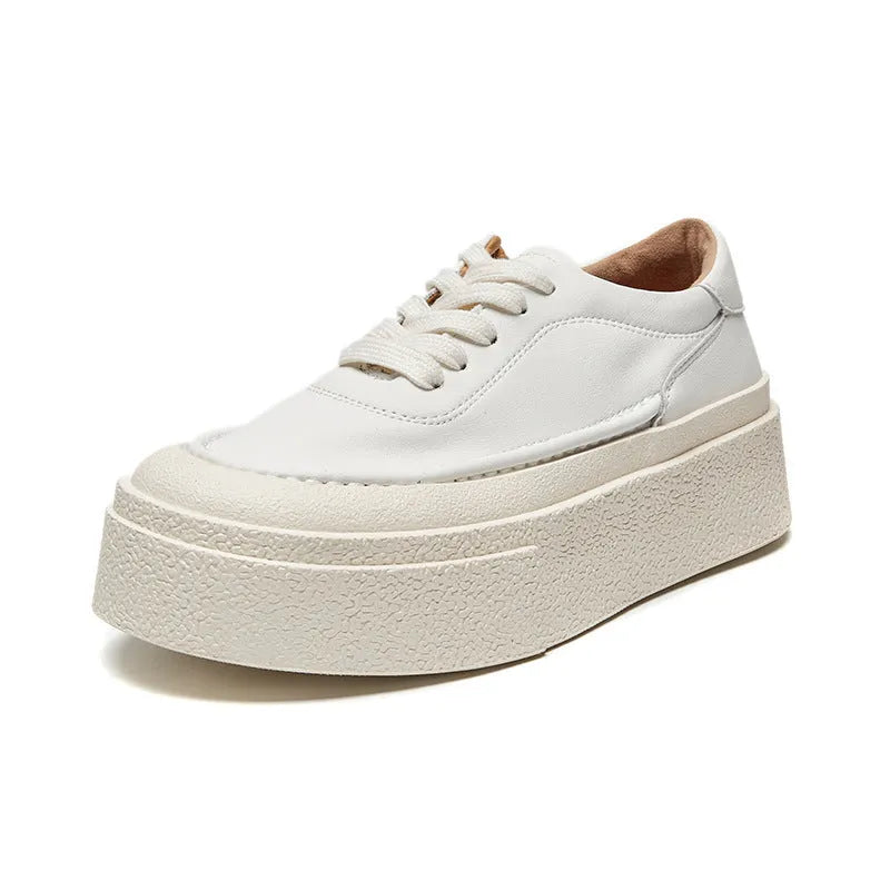 Women's black platform trainers with embossed leather upper and rubber sole