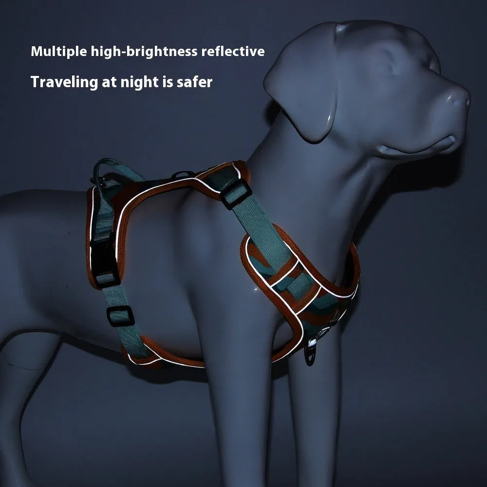 Reflective orange dog harness and lead set with chest and back straps held in a hand.