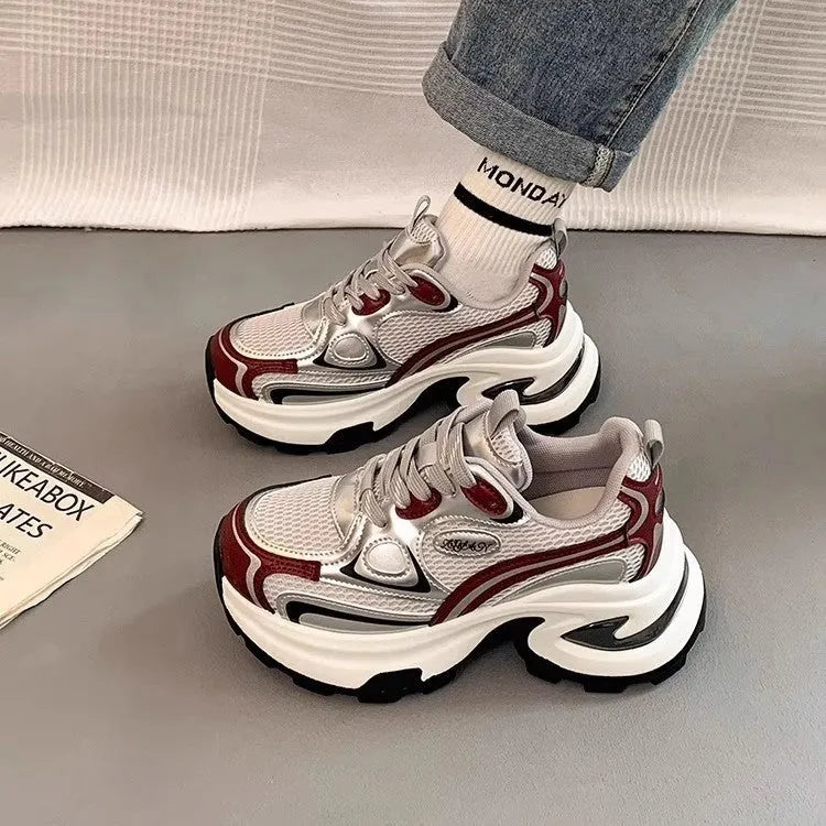 Women's silver and red mesh breathable clunky platform sneakers with a rubber sole.