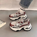 Women's silver and red mesh breathable clunky platform sneakers with a rubber sole.
