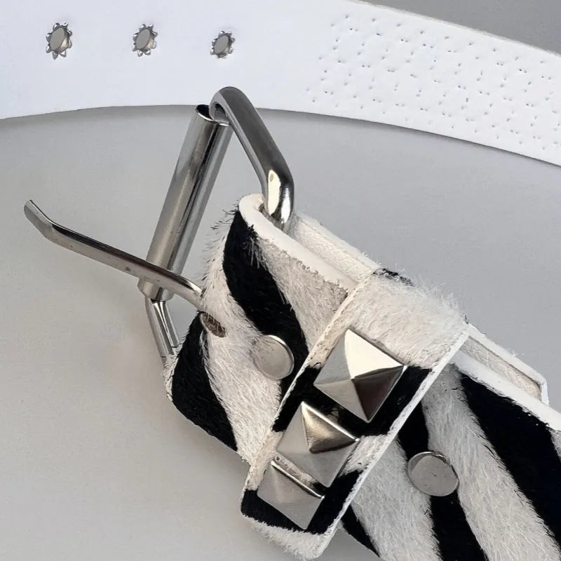 Women's punk style belt with decorative metal rivets on PU leather in animal print pattern with alloy buckle