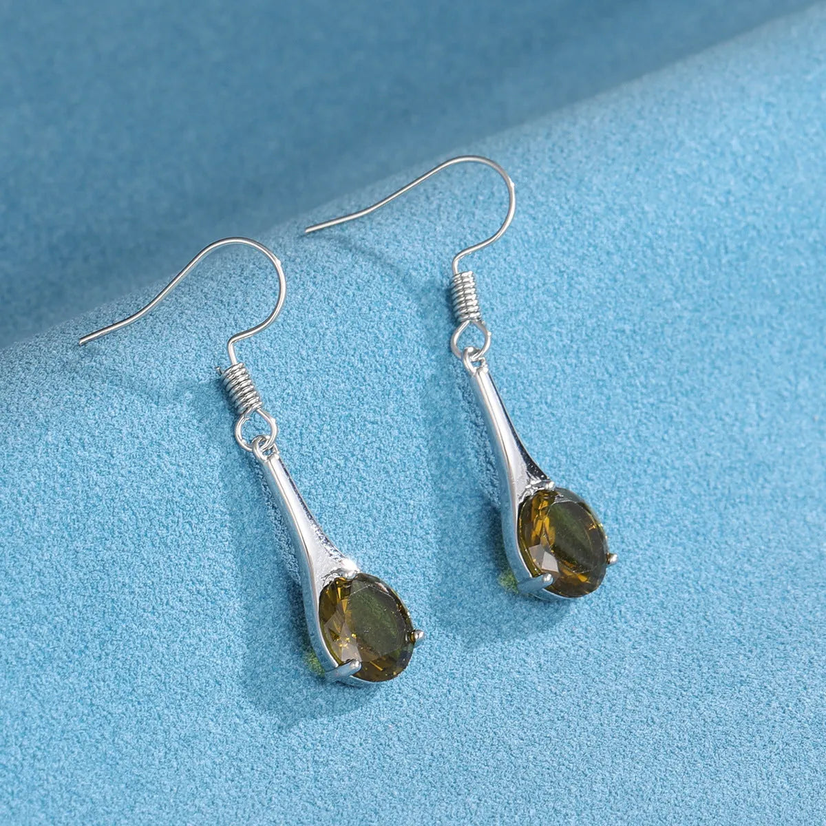Olive green topaz drop earrings with water drop shape and retro style design