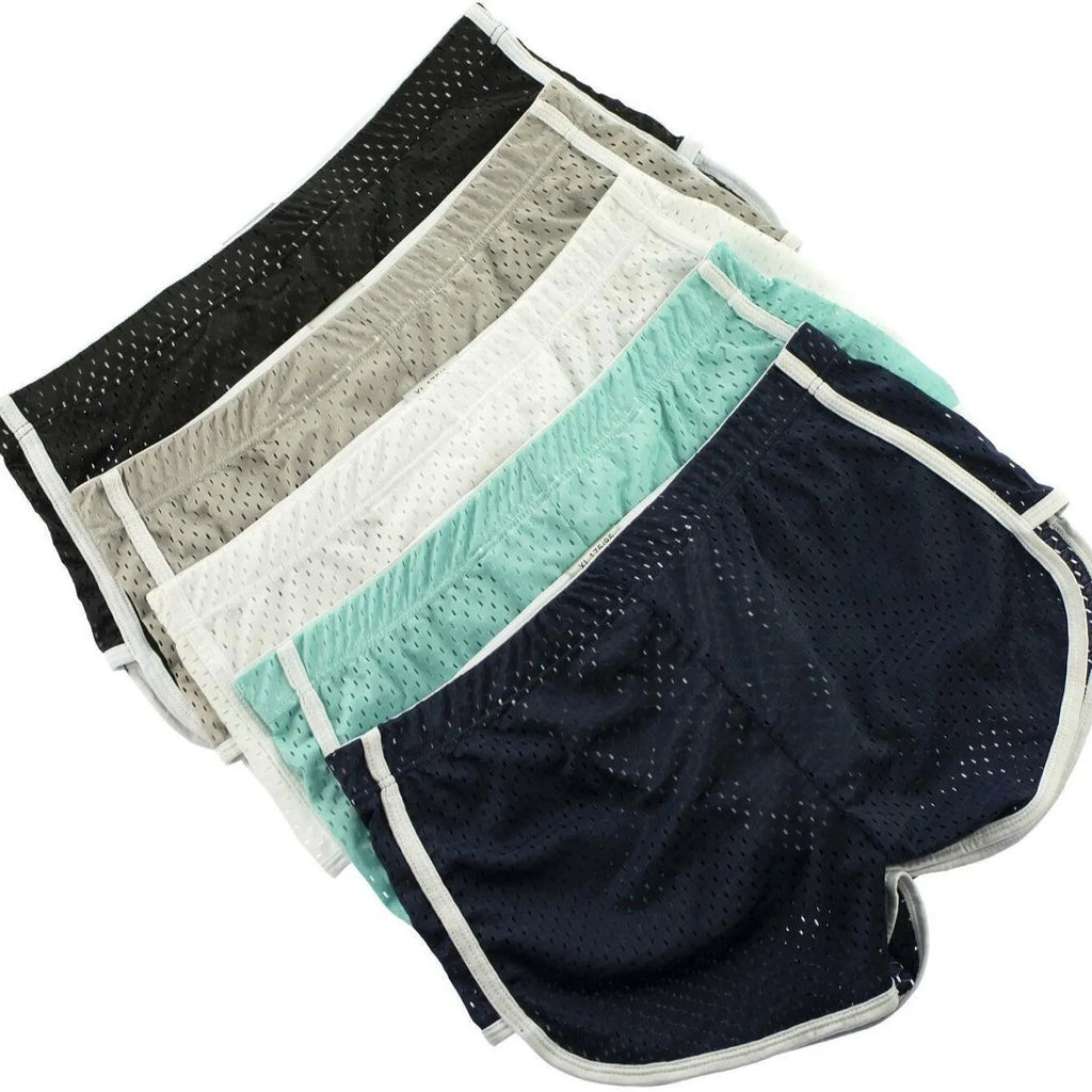 Men's grey cotton blend three-point boxer shorts laid flat, showing mid-waist design and knitted fabric texture.