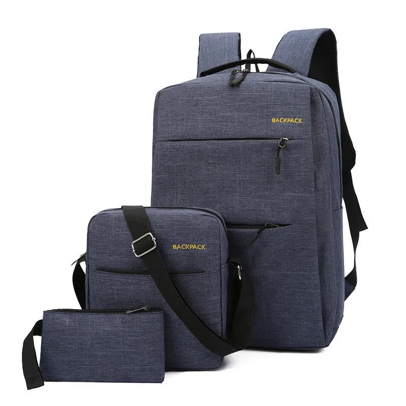 Men's navy blue nylon laptop rucksack with USB port, crossbody bag, and organiser pouch set on a table