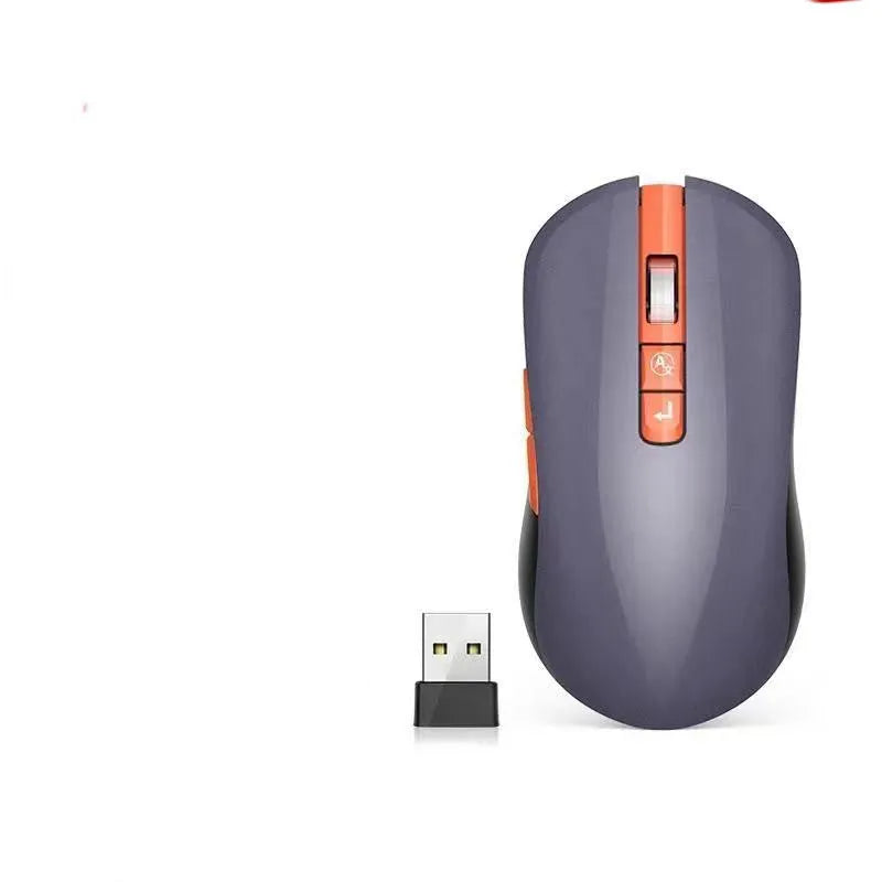 White wireless computer mouse with seven buttons on a desk, showing the USB receiver and voice transcription icon on screen.