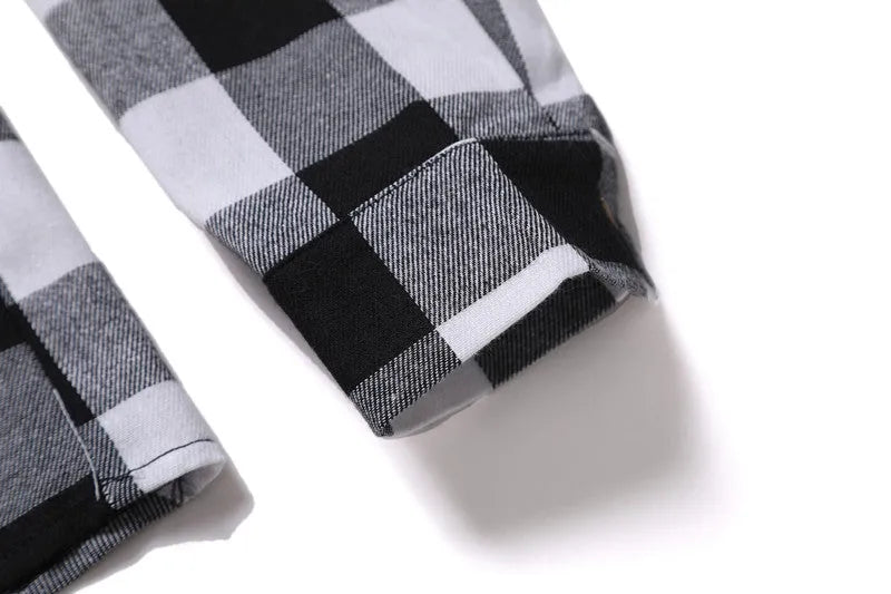 Men's long-sleeved black and white checked shirt with lapel collar and double chest pockets, front view.