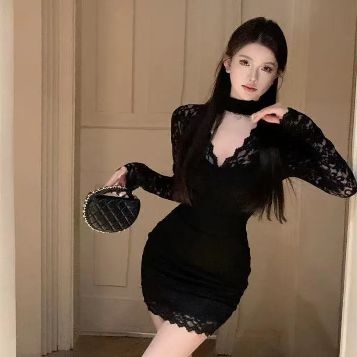 Black halter neck lace dress with floral pattern, high waist, and A-line short skirt on a mannequin.