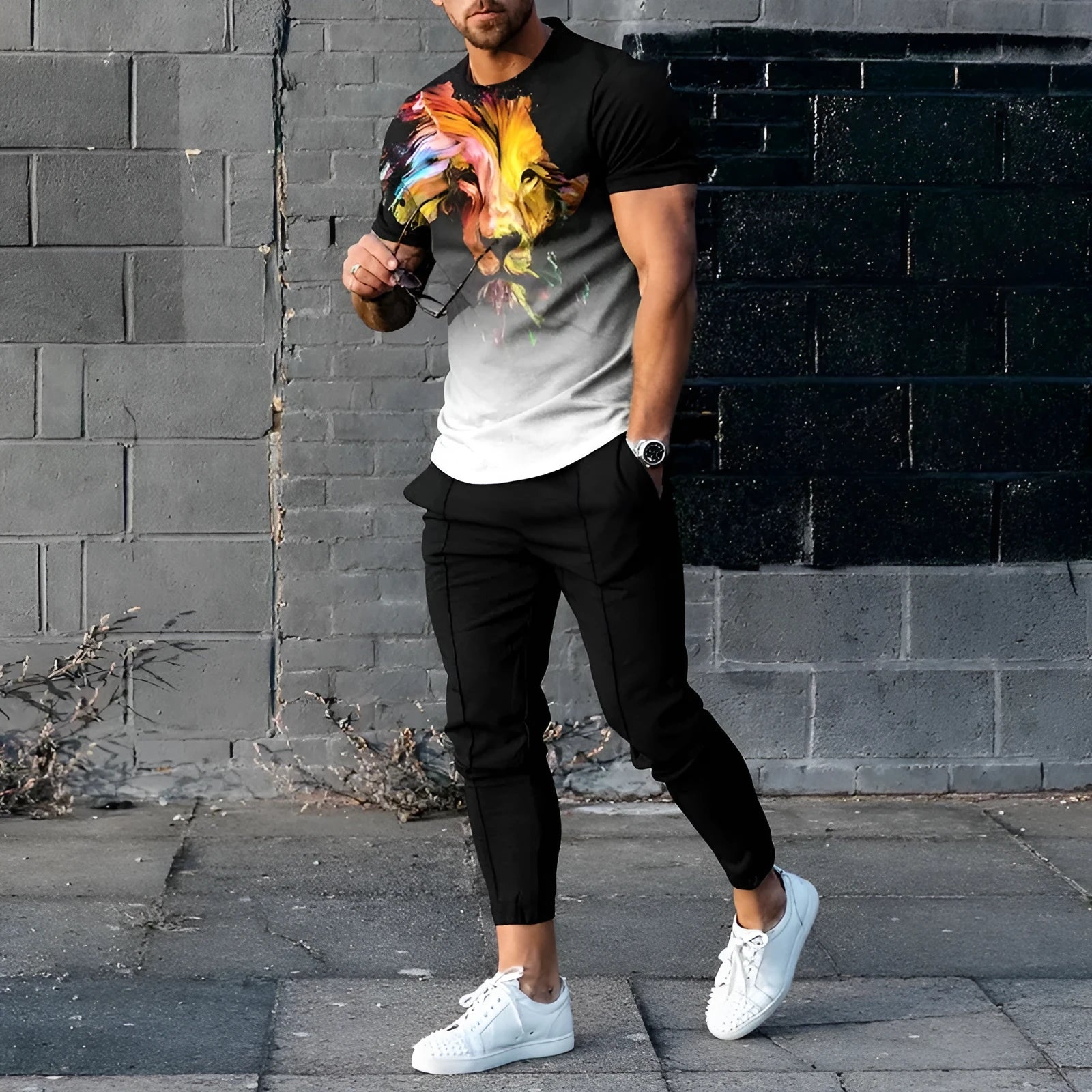 Men's thin short-sleeve printed pullover and matching trousers tracksuit set on a hanger.