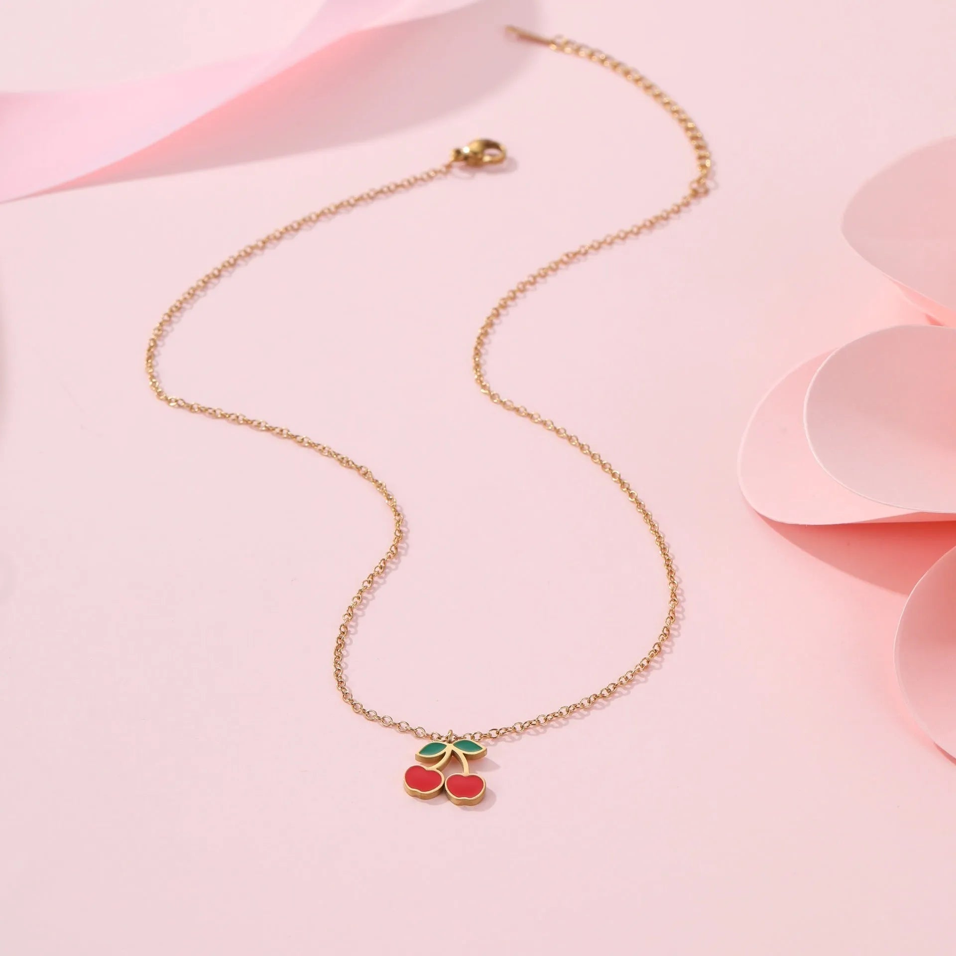 Complete cherry jewelry set with stainless steel necklace, bracelet, earrings, and ring with 18K gold electroplating.