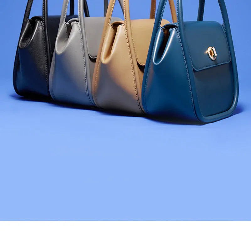 Women's cow leather wing handbag with cross-body strap and hand handles in black colour option